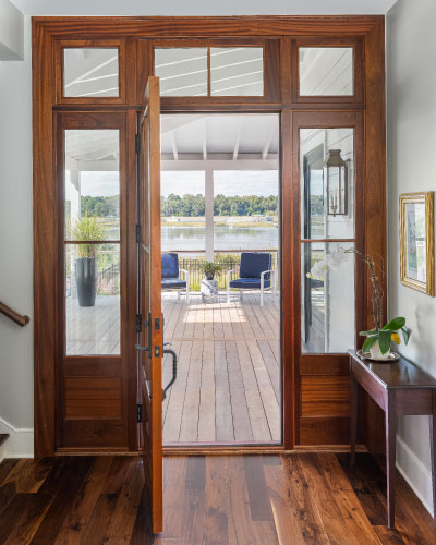 Rear door to custom home, looking out over the covered patio and marsh. Home built by Seaboard builders