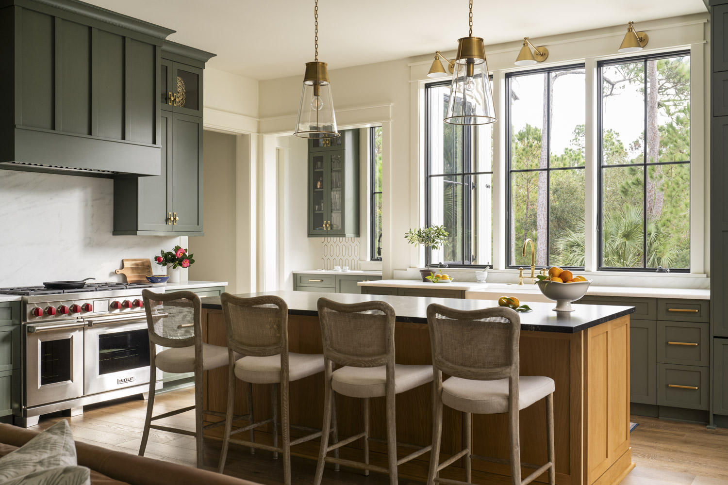 Kitchen Island Large kitchen island with green cabinetry and gold hardware accents