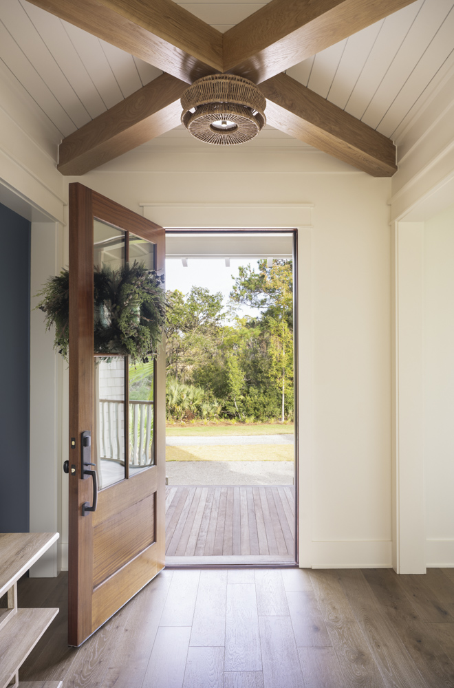 Whitlock - _4481 Front door entry with exposed ceiling beams and summer wreath on the front door