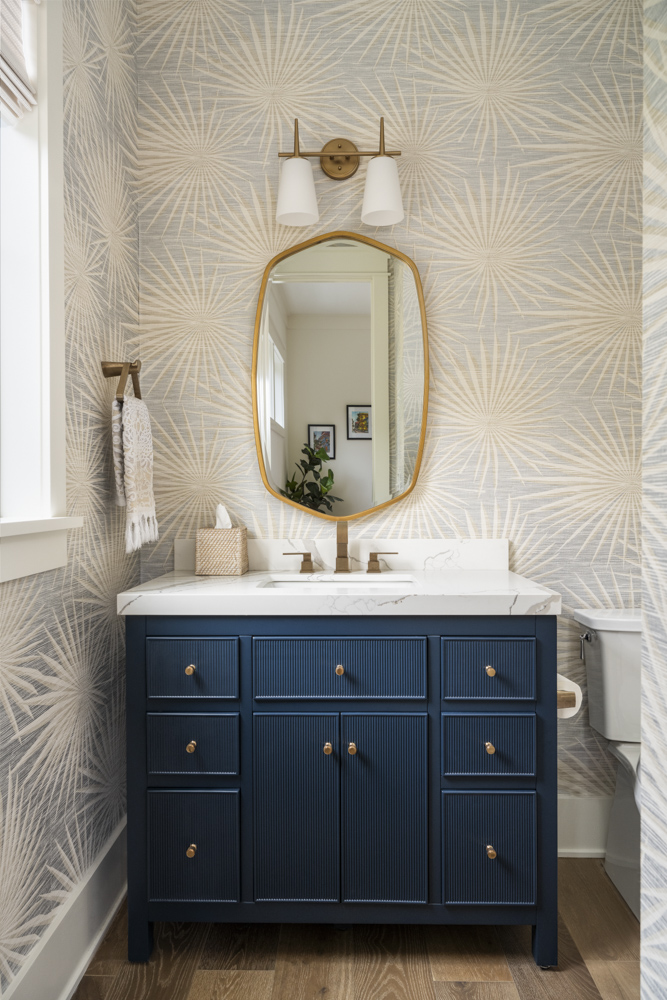 Bathroom Vanity Bathroom vanity with floral-inspired wallpaper, blue cabinet and gold hardware
