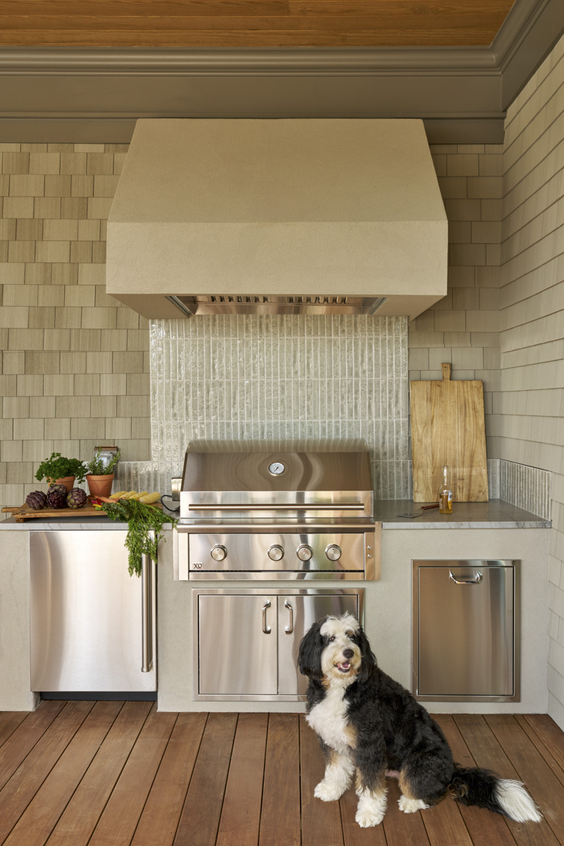 Sage-Vertical-grill+dog Soaking tub in bathroom with shiplap walls and geometric tile floors